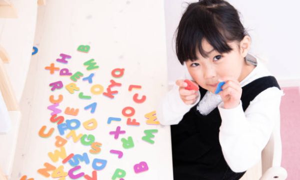 Japanese primary school girl studying English